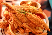 Fried catfish is a popular meal. Acme Oyster House Shrimp and Catfish Platter.jpg