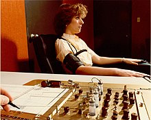 Demonstrating the administration of the polygraph, the polygrapher making notes on the readouts. 1970s Administration of Polygraph.jpg