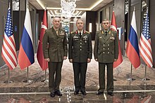 Gerasimov (right), Joseph Dunford (left) and Hulusi Akar (middle) at a meeting to discuss their nations' operations in northern Syria, 6 March 2017 Joseph Dunford, Hulusi Akar and Valery Gerasimov 170307-D-PB383-003 (33152412382).jpg
