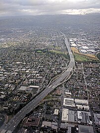 Aerial view of I-280 in San Jose, looking northeast toward the Joe Colla Interchange (I-680/US 101) in the distance