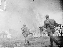 The East Timorese village of Mindelo (Turiscai) is burnt to the ground by Australian guerrillas to prevent its use as a Japanese base, 12 December 1942 Native village burning.jpg