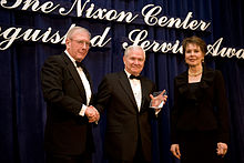Julie Nixon Eisenhower presents the Nixon Center's Distinguished Service Award to then U.S. Secretary of Defense Robert M. Gates in February 2010 Nixon Center presents award to Robert Gates.jpg