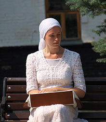 Orthodox pilgrim in the Laure of Kyiv-Perchesk. Pilgrims have to wear modest clothes and women and girls must cover their hair when entering a church or monastery. Orthodox pilgrim.jpg