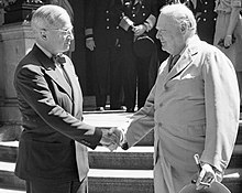 Truman shakes hands with Churchill on 16 July 1945 (the first day of the Potsdam Conference, and only ten days before Churchill lost the premiership upon the announcement of the results of the 1945 election). President Harry Truman and Winston Churchill shake hands on the steps of Truman's residence during the Potsdam conference, 16 July 1945. BU8944 (cropped).jpg