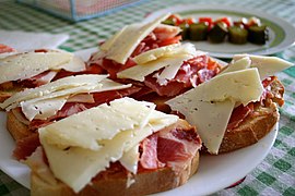 Open-faced ham and cheese tapas-style sandwiches