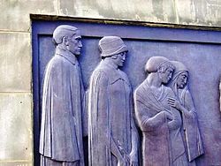 Part of relief on Liverpool Cenotaph. Some of the mourners.