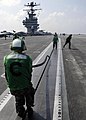 US Navy 050120-N-4166B-079 Sailors from the Air Department place a rubber seal into catapult shuttle number one on the flight deck aboard USS Abraham Lincoln (CVN 72) after launching aircraft.jpg