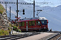 Treno a la stazion de Alp Grüm