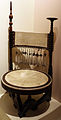 Sedia circolare, 1902 legno bicolore con inserti di metallo e rame, pergamena dipinta e decorazioni di passamaneria