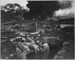 U.S. Marines observing the battle from trench positions, June 3, 1942 Japanese attack on Dutch Harbor, June 3, 1942. Group of Marines on the "alert" between attacks. Smoke from burning... - NARA - 520589.tif