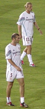 Zidane (left) with David Beckham at Real Madrid.