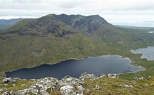 Full ridge of Ben Lugmore and Lug More corrie, viewed from across Doo Lough, on Barrclashcame