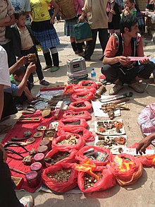 Illegal medicinal products being sold at a market in China. Products include tiger claw and tiger penis Chinese illegal medicinal products.jpg