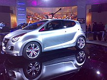 A view of a white coloured car put for show at Auto expo