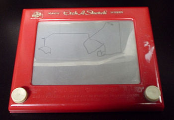 The classic red-and-white Etch A Sketch model