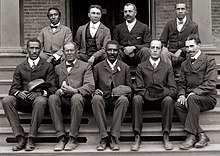 George Washington Carver, front row, center, poses with fellow faculty of Tuskegee Institute in this c. 1902 photograph taken by Frances Benjamin Johnston. George Washington Carver, ca. 1902.jpg