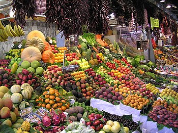  Fruit and vegetables on display at a market.
