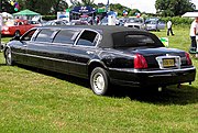 A black Lincoln Town Car "stretch" limousine at a car show in Bristol, England