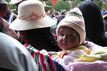 Baby being carried Little baby from Puno.jpg