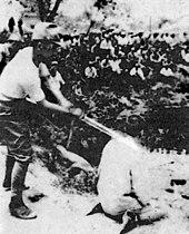 A Chinese POW about to be beheaded by a Japanese officer with a shin gunto Photo 07 (The "Shame" Album).jpg