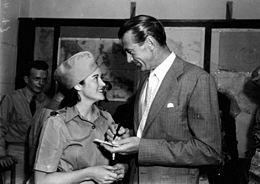 Photo of Gary Cooper signing an autograph