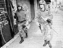 Soldiers of the California National Guard patrol the streets of Los Angeles in response to street rioting. ANG40InfantryDivisionLosAngelesRiot1992.jpg