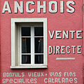 Publicité murale pour la vente d'anchois à Collioure.