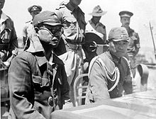 Japanese commanders listening to the terms of surrender COLLECTIE TROPENMUSEUM In de haven van Kupang (Timor) luisteren de Japanse bevelhebber kolonel Kaida Tatuichi en zijn stafcommandant majoor Muiosu Slioji aan dek van H TMnr 10001519.jpg