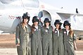 Five aspiring female pilots from the IAF Flight Academy in 2011, a retired IAI Kfir behind