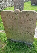 A photograph of a headstone