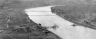 An aerial view of the Ludendorff Bridge after it collapsed on 17 March 1945. Two treadway pontoon bridges are visible to the north. Ludendorff Bridge collapse.jpg