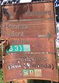 Transport font road sign in poor state of repair, Kagera Region, Tanzania