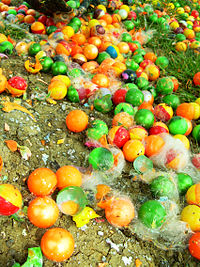 Many used or smashed paintballs on the floor.