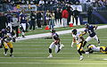 Tyrone Carter (23) and Anthony Madison (37) prepare to tackle B. J. Sams, 2006.