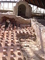 Tepidarium 1 avec son hypocauste, le petit frigidarium au fond