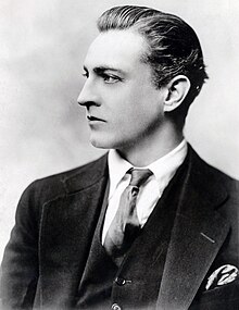 Head and shoulder shot of Barrymore, cleanshaven, in profile, facing to the left