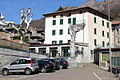 The entrance to Ex-Albergo Grigna (on the left); the square in front of it can be closed to the traffic.