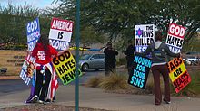 Members of the Westboro Baptist Church protesting a Jewish Community Centre. Phelps-Roper would join her church members at protests similar to this one.