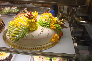 Pastel de Gallo en Chinatown, Londres, para las celebraciones del Año Nuevo chino .