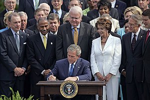 President George W. Bush signs the reauthoriza...