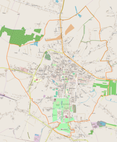 Mapa konturowa Buska-Zdroju, blisko centrum na lewo znajduje się punkt z opisem „Przy Cmentarzu”