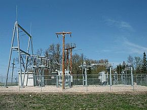 A 115 kV to 41.6/12.47 kV 5 MVA 60 Hz substation with circuit switcher, regulators, reclosers and control building at Warren, Minnesota. It shows elements of low-profile construction, with apparatus mounted on individual columns. Electrical Substation.JPG