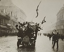An automobile loaded with communists dashing through streets of Budapest, March 1919 Enemy Activities - Miscellaneous - The Hungarian Revolution. Automobile loaded with revolutionists dashing through streets of Budapest - NARA - 31480144 (cropped).jpg