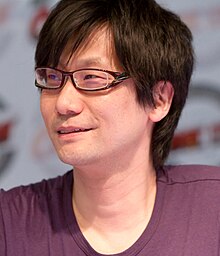 Hideo Kojima at an autograph session looking to his right at the Japan Expo convention in 2010.