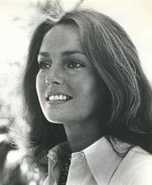 A black-and-white headshot of a woman