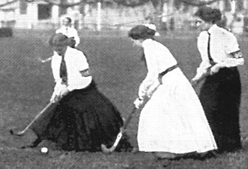 Women playing field hockey ca. 1910, when long...
