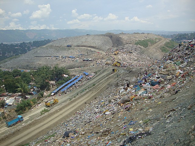 Shanty town beside rubbish dump