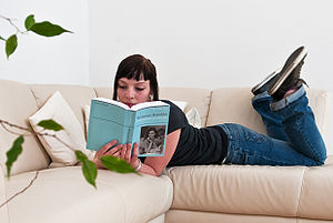 English: Girl Reading a Wikpedia-Book from Ped...