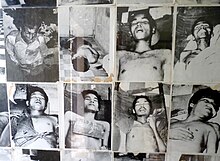 Rooms of the Tuol Sleng Genocide Museum contain thousands of photos taken by the Khmer Rouge of their victims. Photos of victims in Tuol Sleng prison (2).JPG