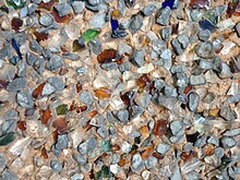 Rock dash stucco used as an exterior coating on a house on Canada's west coast. The chips of quartz, stone, and colored glass measure approx. 3-6 mm (1/8-1/4"). Stucco rock dash - detail.JPG